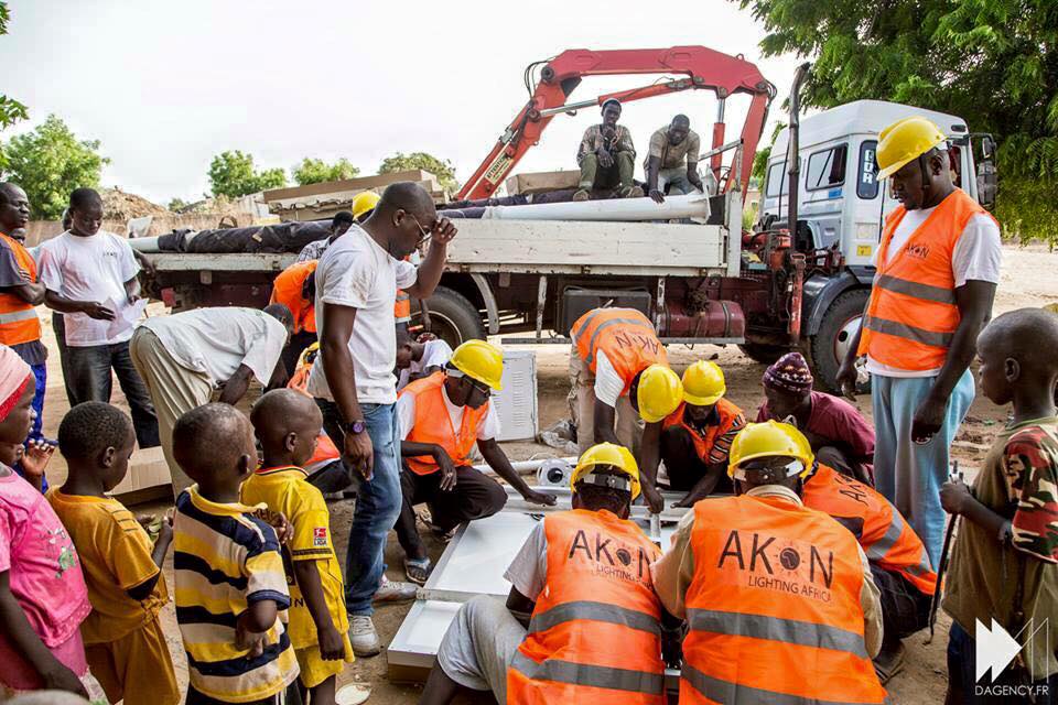 Akon Lighting Africa workers have been installing solar-powered street lights and residential systems across at countries in Africa