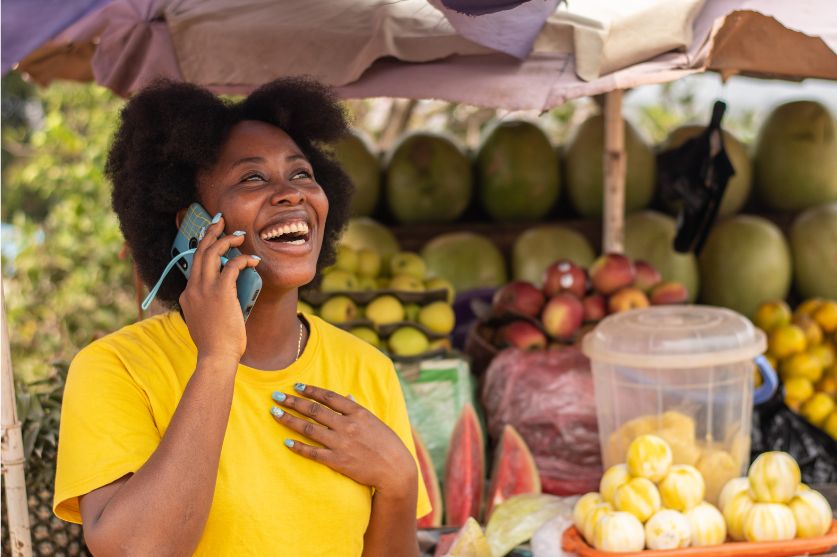African woman holding a cellphone