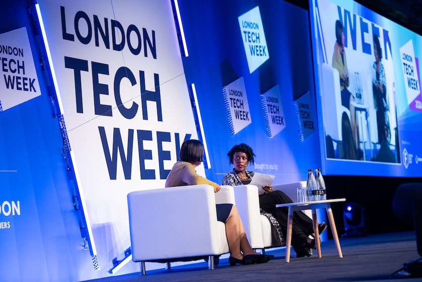 UrbanGeekz CEO Kunbi Tinuoye moderating a panel discussion at London Tech Week with Tara McGeehan, President of CGI UK and Australia